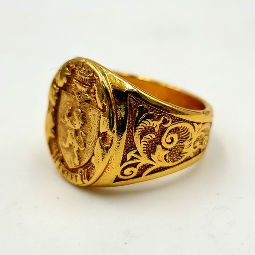 448 - A gold toned insignia Gents ring size U.
Weight: 13.23 grams With a lion and the word sweet. Its mar... 