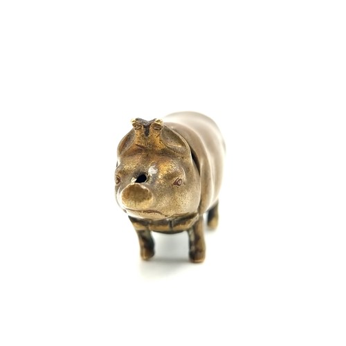 720 - A nice example of a Victorian brass vesta case in the form of a pig. 
Weight: 14.57 grams the Head l... 