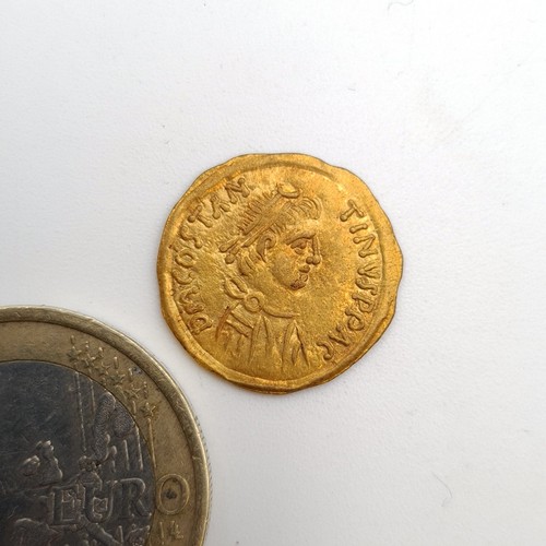 742 - Star Lot: An ancient Roman Gold coin from the reign of Tiberius II Constantine circa 500-1000 AD. We... 