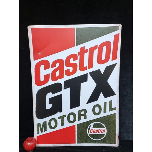 100 - A large metal sign advertising Castrol GTX Motor Oil in the brands trademark shades of red, green an... 