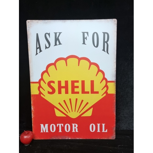 101 - A large metal sign advertising Shell Motor Oil, with the brands trademark red and yellow shell, read... 