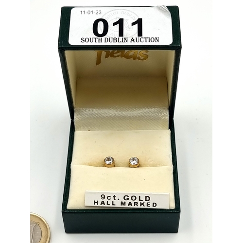 11 - A pretty pair of as new 9 carat Gold stud earrings, featuring gem stone detailing and butterfly back... 