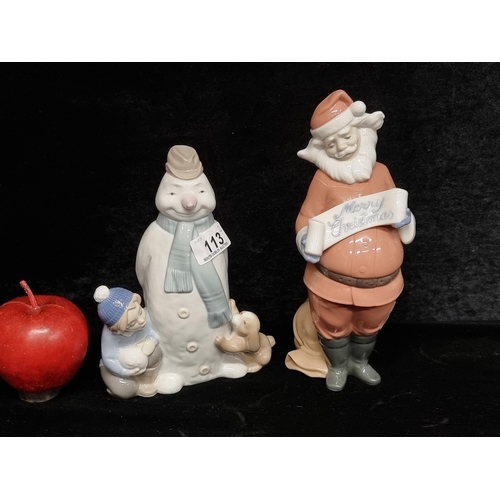 113 - Two festive Nao porcelain figurines, comprising of Santa and a snowman with young boy and puppy. The... 