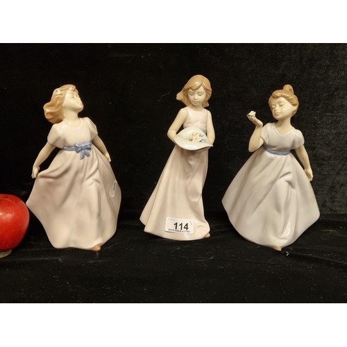 114 - A collection of three very pretty Nadal porcelain figurines of three winsome young ladies, two of wh... 