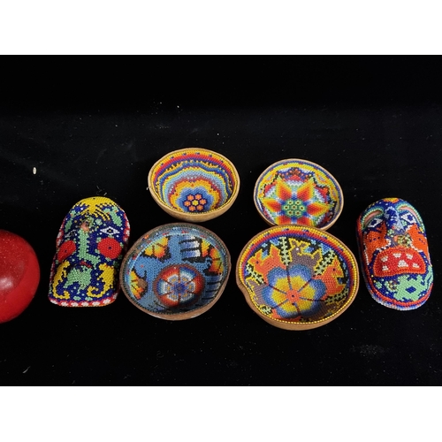 A collection of beaded Mexican folk art pieces, with vivid beautiful ...