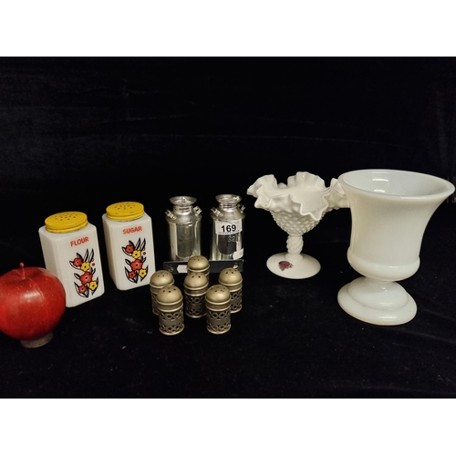 A selection of eleven collectible items including a set of six EPNS salt & pepper shakers with Bristol blue glass liner, and a milk glass pedestal compote bowl by Fenton. Along with two very nostalgic flour and sugar shakers featuring a retro hand-painted motif and a salt and pepper in the form of milk churns.