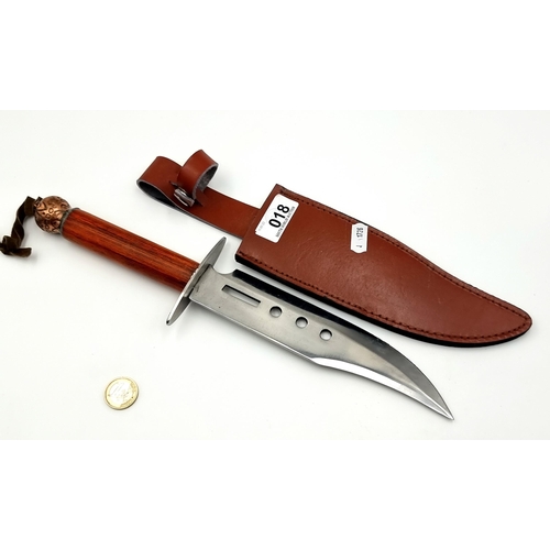 18 - A large and excellent example of a stylised hunting knife, set with polished Rose wood handle and a ... 