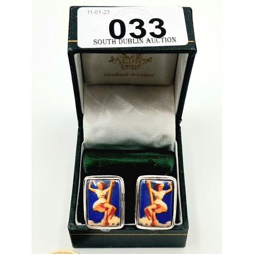 33 - An unusual pair of vintage sterling silver cuff links, these examples depict a enamelled colourful l... 