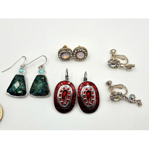 38 - A collection of good quality earrings, in an array of styles and designs and consisting of three pai... 