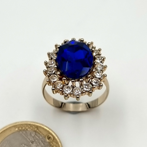 40 - A show stopping Blue Tourmaline facet cut cocktail ring, this beautiful ring features a gem set Halo... 