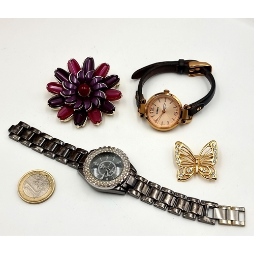 41 - A collection of jewellery items, consisting of a Fossil watch with gem stone face, two attractive br... 