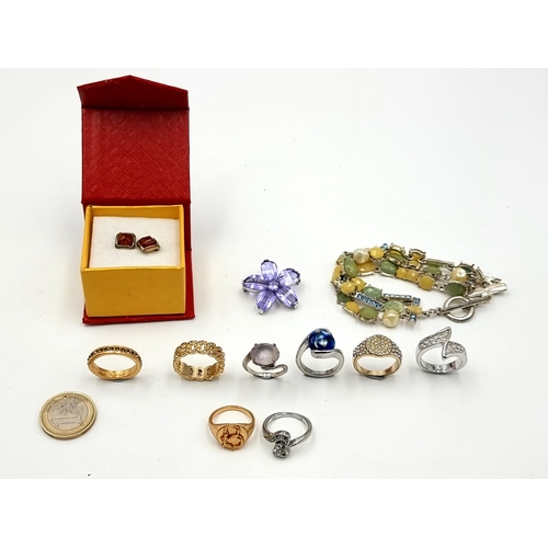 44 - A collection of jewellery, consisting of a pair of sterling silver Amber stud earrings, nine gem set... 