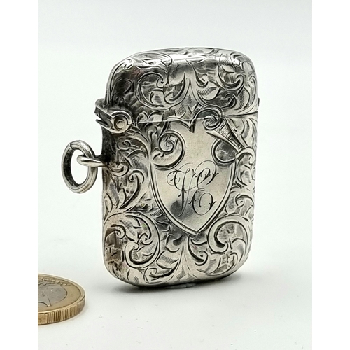 45 - A sterling silver antique vesta case of foliate design and initialled cartouche. Hallmarked Birmingh... 