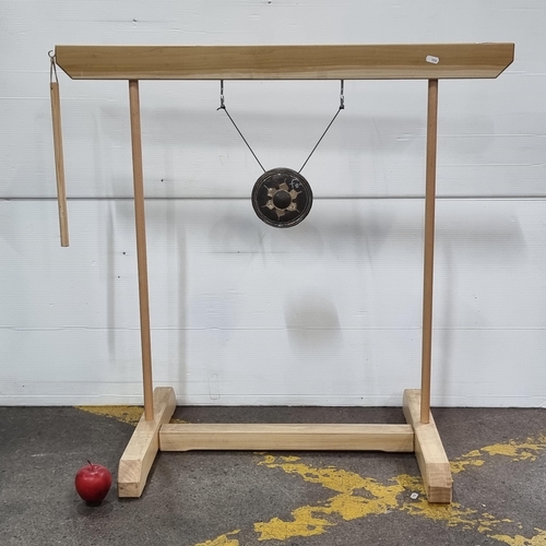 492 - A very interesting gong with wooden frame and painted metal gong suspended in the centre.