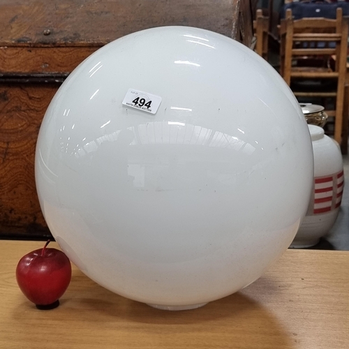 494 - A very large antique milk glass globe shade in good condition.