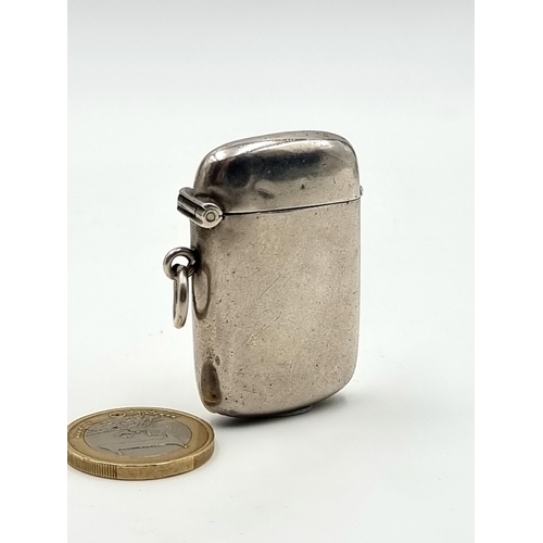 50 - A nice clean example of a  Sterling Silver vesta case. Stamped Birmingham with match striker to the ... 