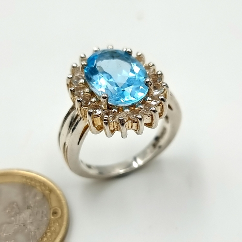A striking sterling silver Blue Topaz cluster ring, set with a gem ...