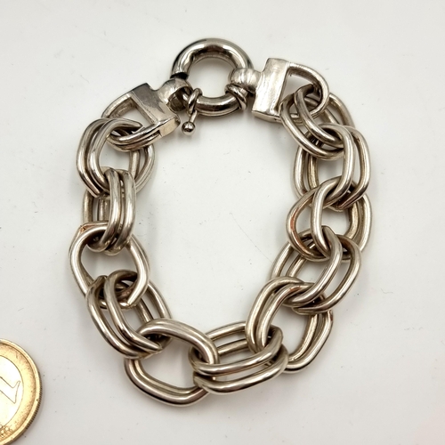 57 - A great quality heavy sterling silver exaggerated chain link bracelet. Total weight: 61.43 grams.