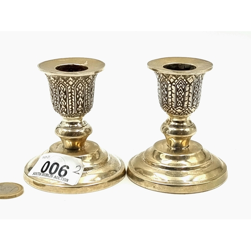 6 - An unusual pair of Sterling Silver candlesticks, featuring an Indian inspired geometric motif and gr... 