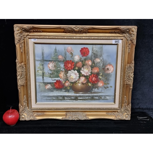 82 - An original oil on canvas painting featuring a bountiful bouquet of carnations in pink and red, by t... 