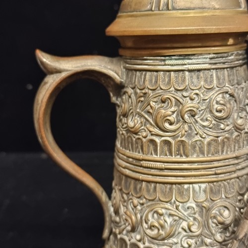 117 - Star lot : A highly decorative brass tankard in the form of a traditional 19th century Royal Prussia... 