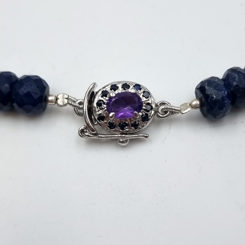 8 - A beautiful graduated 219 carat midnight blue Sapphire necklace, set with a fine Amethyst sterling s... 