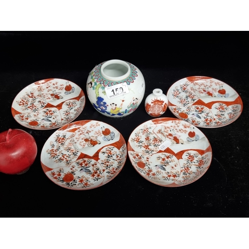 150 - A selection of Japanese fine china pieces. Including a set of four handpainted plates with a cherry ... 