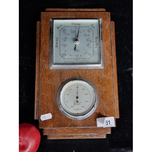 151 - An Art Deco Rototherm barometer and thermometer. Housed in a oak case and featuring sconced detail.