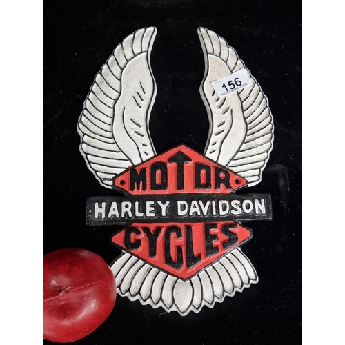 156 - A cast metal Harley Davidson advertising plaque. Featuring the winged motifs associated with the com... 