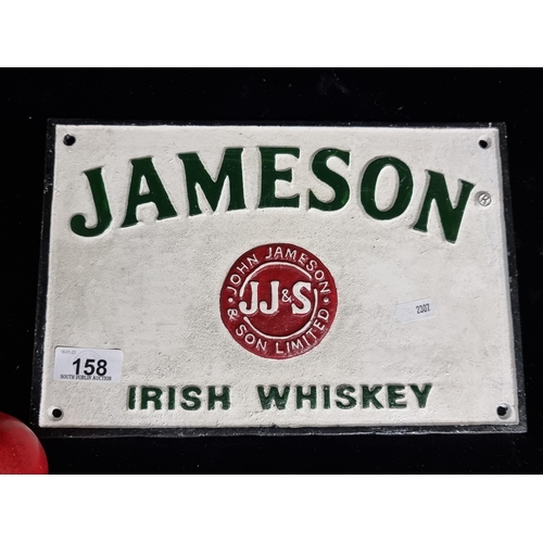 158 - A heavy cast metal plaque advertising Jameson Irish Whiskey. In a hand-painted vintage colour palett... 