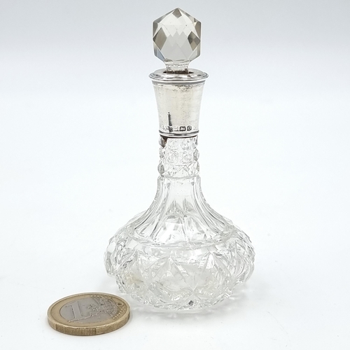 20 - A very pretty cut glass perfume bottle and silver collar. This example features a circular cut stopp... 