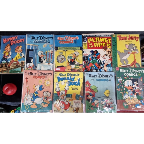 257 - Nine vintage comic books including examples by Walt Disney, Looney Tunes' Tom and Jerry and Stan Lee... 