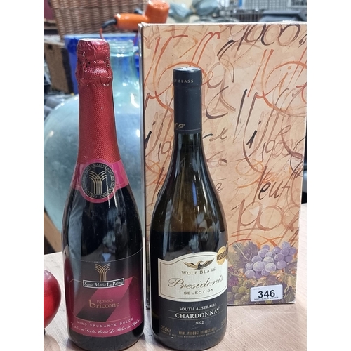 346 - A box containing two sealed bottles of wine including a 2002 Wolf Blass chardonnay along with a Sant... 