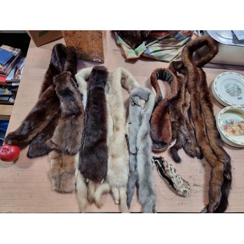 347 - A large number of genuine vintage mink fur stoles in colours ranging from white to dark brown.