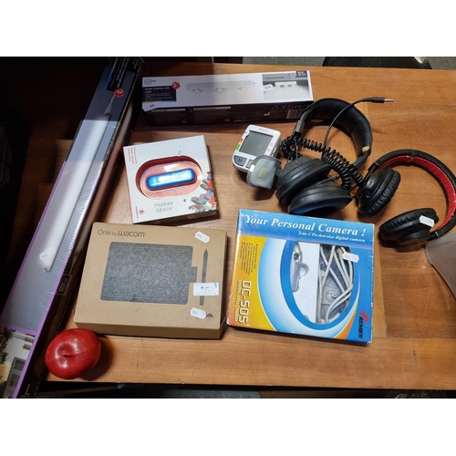 357 - Seven items including a Wacom drawing tablet in original packaging, two Phillips headphones, a pocke... 