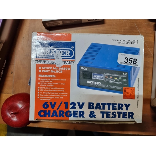 358 - A 6V/12V battery charger and tester in original packaging.