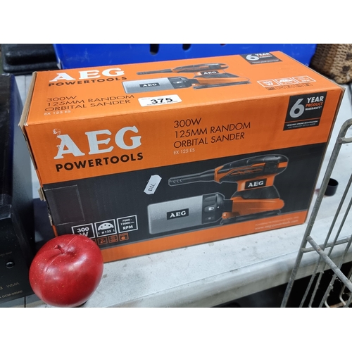 375 - An AEG Power-tools Random Orbital Saw. 125mm and powered at 300W. Brand new in original box. Model E... 