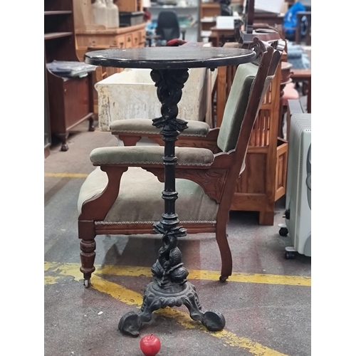 384 - An antique tall circular bar table with ornate cast metal base and wooden top. This is a chest high ... 