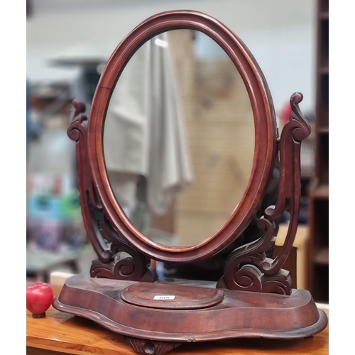 385 - An elegant Victorian red mahogany tilting oval vanity mirror . Featuring pierced foliage design. H65... 