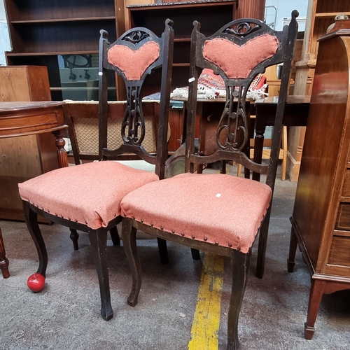 389 - A pair of Victorian parlour chairs with pierced splatbacks. With original seat springs and red uphol... 