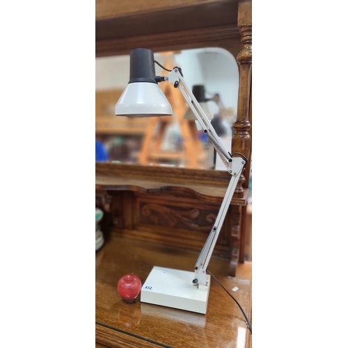 412 - A vintage Luxo Twin 2 desk lamp with articulated stem. In a cream and matte black finish and a three... 