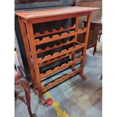 421 - A very functional four-shelf wine rack to fit twenty-four bottles. H91cm x W73cm x D36cm.