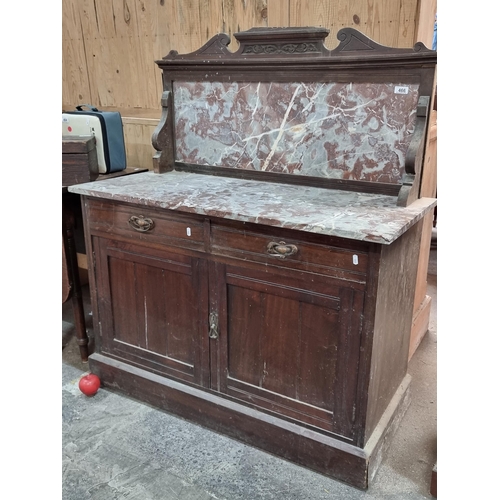 466 - A nice example of an Edwardian  washstand with marble top and splash back, this piece is finished wi... 