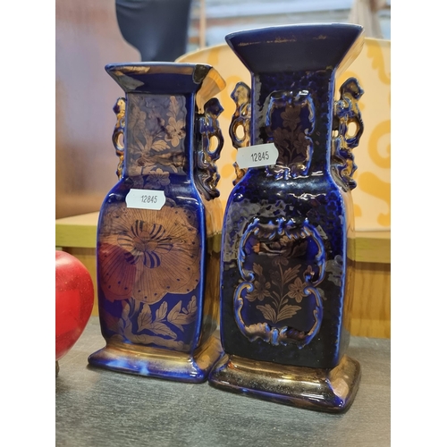 468 - A pair of Chinese temple vases in an unusual copper lustre with cobalt blue glaze overlay. Featuring... 