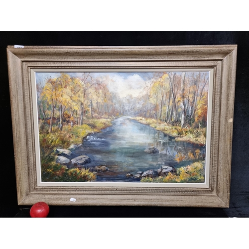 69 - Star Lot : A large charming original oil on canvas painting featuring an autumnal riverside forested... 