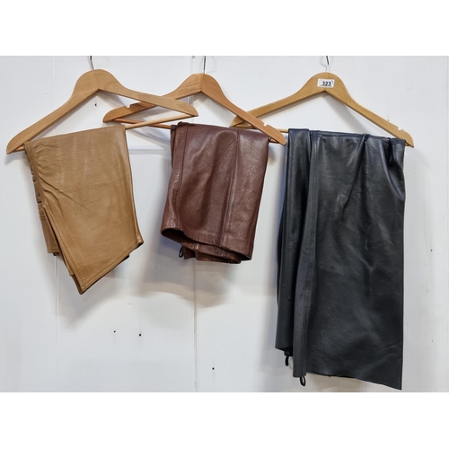 323 - Three leather ladies items including a pair of Savida black trousers (uk size 16), a chocolate brown... 