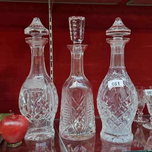 A trio of cut crystal decanters all of which are vintage Waterford Crystal pieces. Including a Shannon Jubilee and Clare patterned example. All in good condition with original stoppers and acid etching to base. One is engraved.