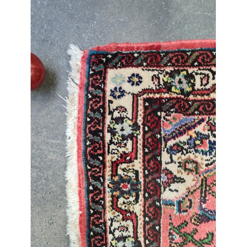 448 - Star Lot : A handwoven Hamadan runner rug in shades of red with multicoloured detailed pattern and c... 