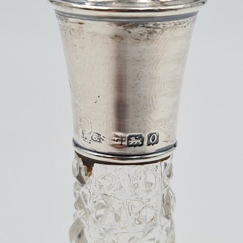 20 - A very pretty cut glass perfume bottle and silver collar. This example features a circular cut stopp... 