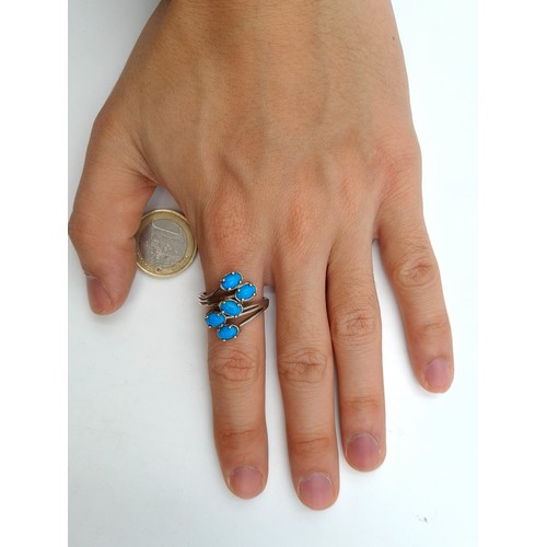 40 - A pretty sterling silver five stone Turquoise ring. Ring size: R. Weight: 3.18 grams.